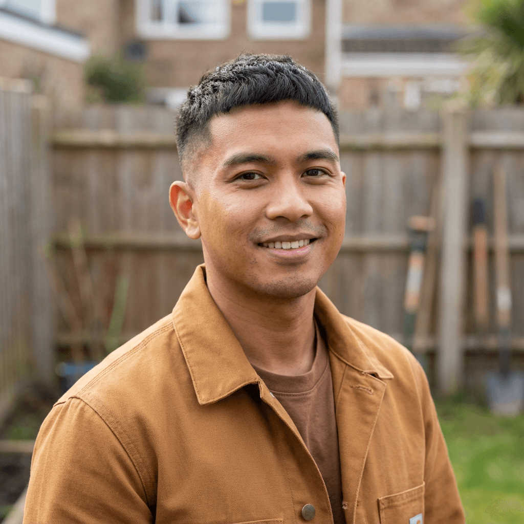 Mark T., a homeowner in his 40s, standing in front of a renovated house